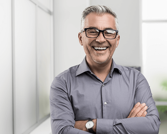 man with arms crossed and smiling