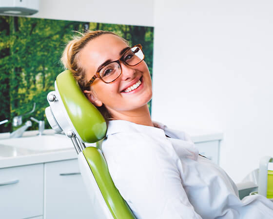 smiling woman sitting in a dental chair