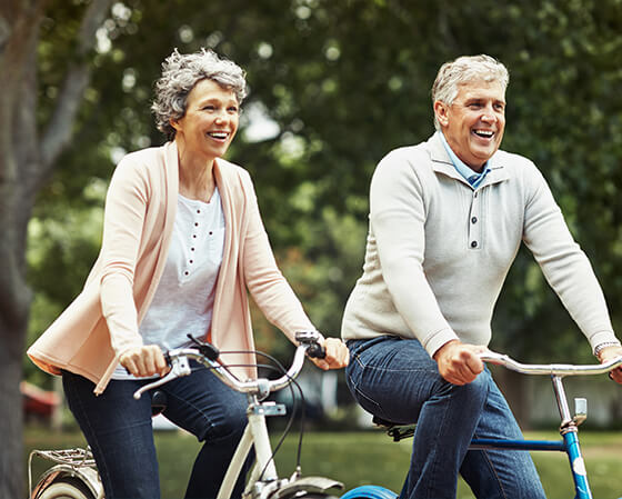 senior couple riding bikes