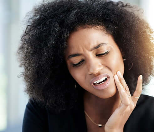 woman with tooth pain